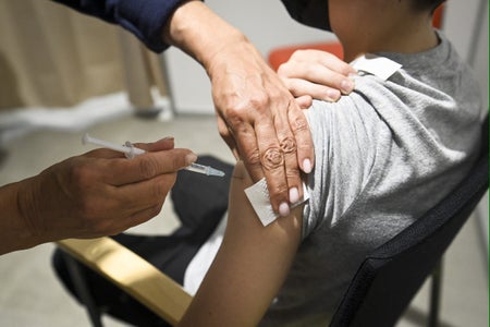 A twelve-year-old boy receives a dose of the Pfizer-BioNtech Covid-19 vaccine in Espoo, Finland on September 24, 2021.