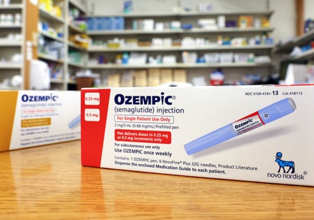 Boxes of the diabetes drug Ozempic rest on a pharmacy counter