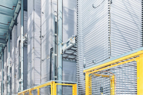 The inside of a plant facility with gray and yellow equipment