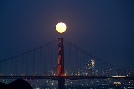 Supermoon rising over Golden Gate Bridge